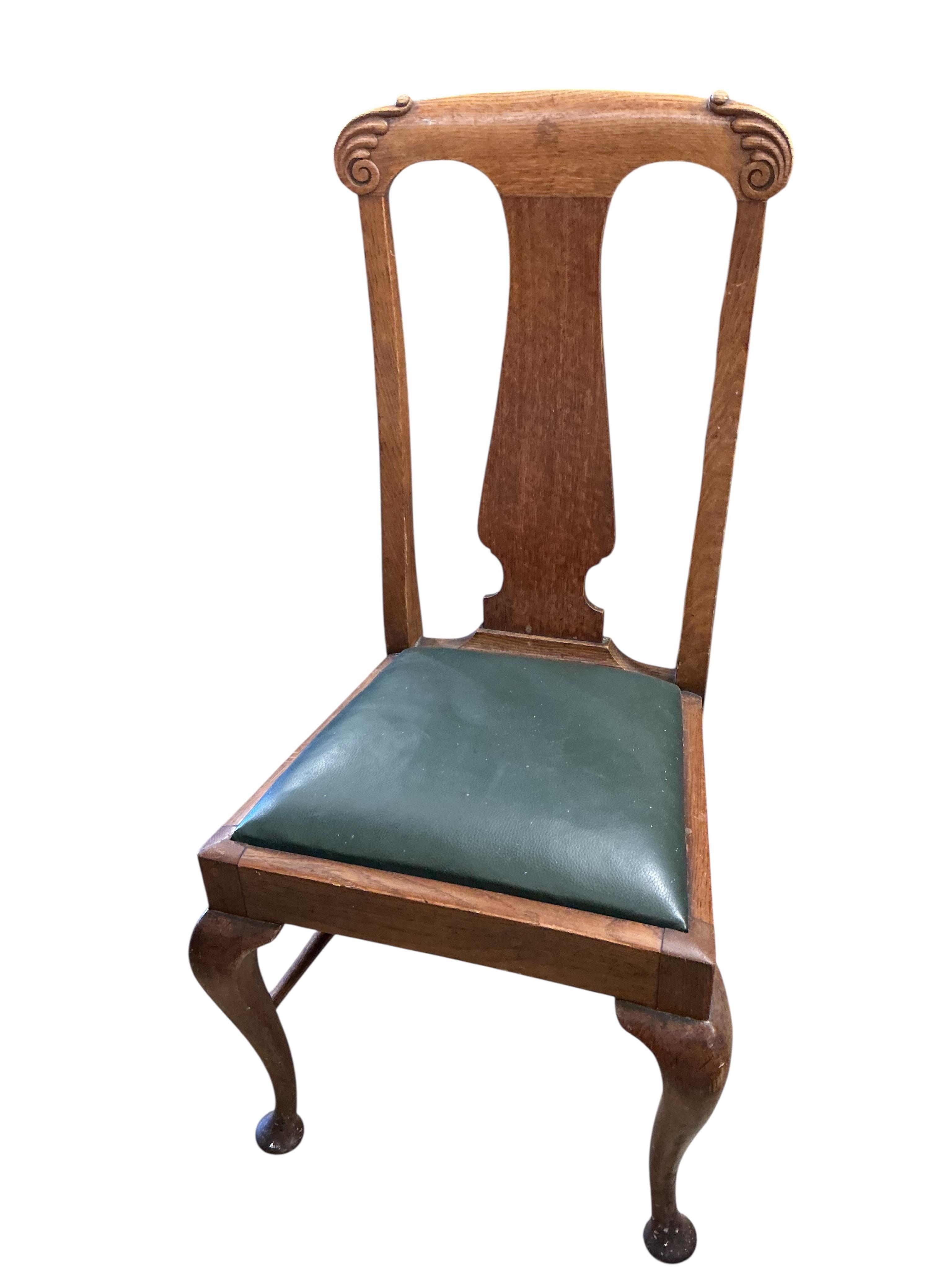 A set of eight early 20th century oak dining chairs, two with arms